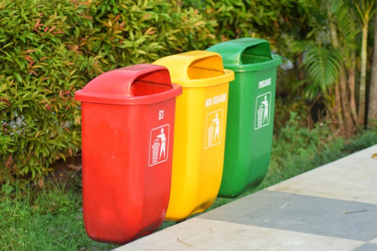 Color-coded bins for non hazardous waste segregation to promote better recycling and disposal practices.